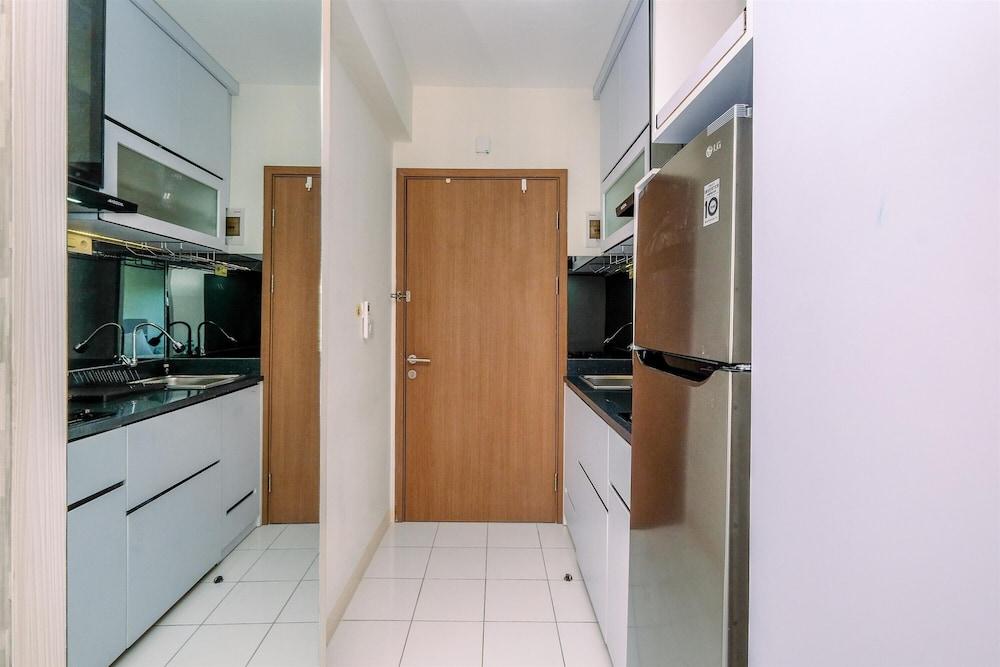 Warm and Cozy Design Studio at Podomoro Golf View Apartment