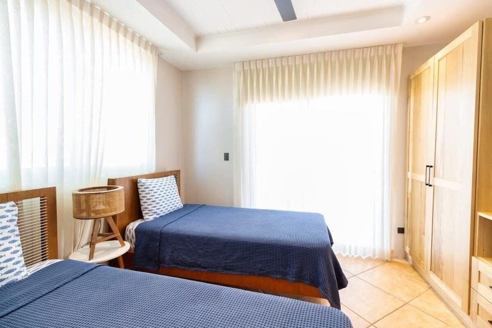 Stunning Mountaintop Property with Stylish Main Home, Private Guesthouse & Infinity Pool