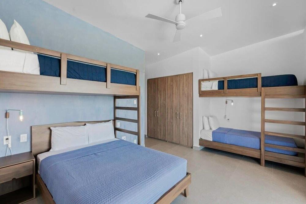 Luxurious Ultramodern Property with Private Suites, Infinity Pool, and Sweeping Ocean and Mountain Views