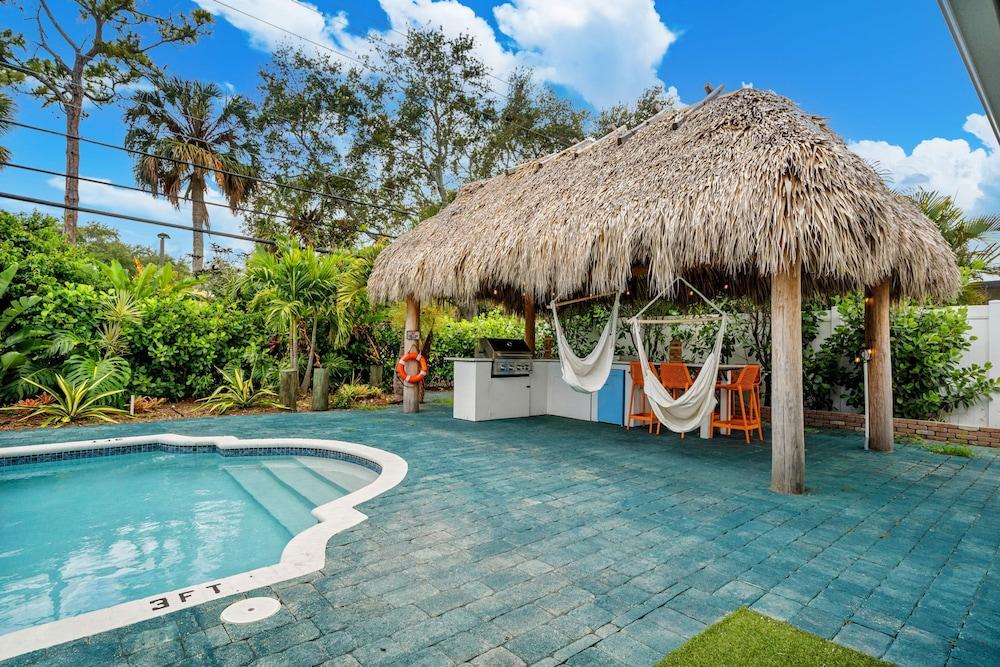 Eccentric Home With Pool Tiki hut Outdoor Kitchen
