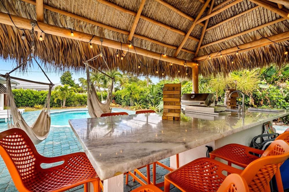 Eccentric Home With Pool Tiki hut Outdoor Kitchen