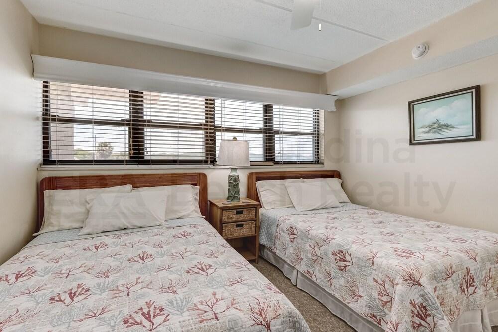 Upper unit Overlooking the Beautiful Outdoor Space and Pier by RedAwning