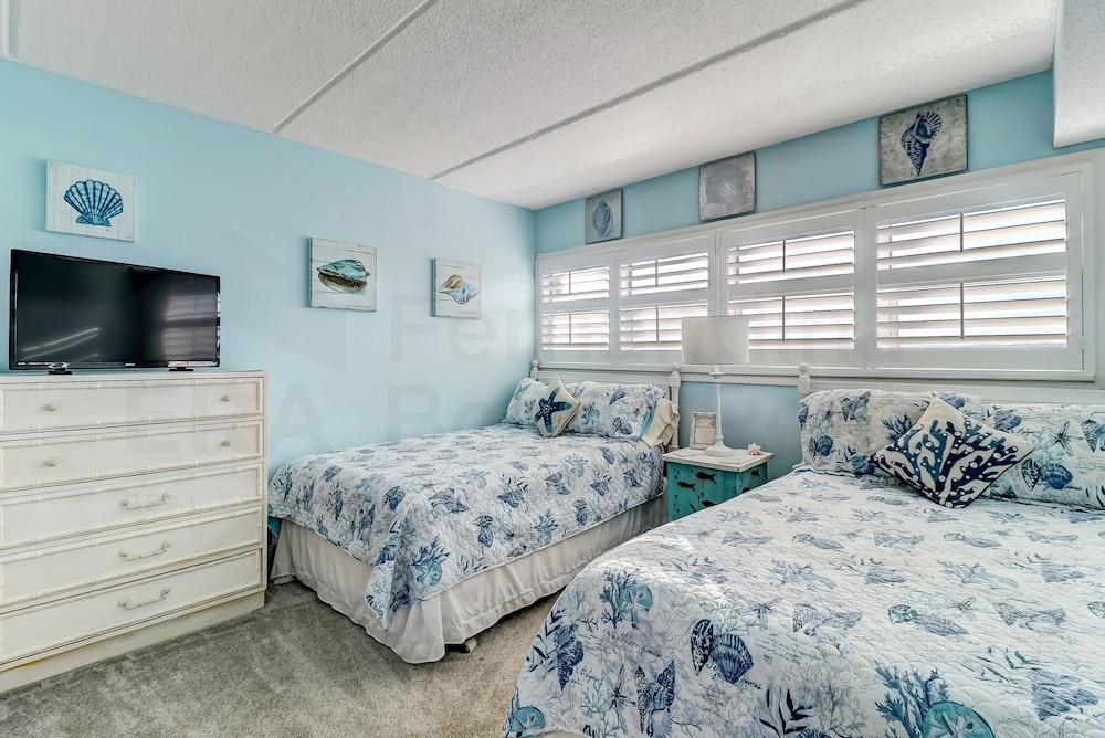 Amelia by the Sea Oceanfront Condo with Access to Private Fishing Pier by RedAwning