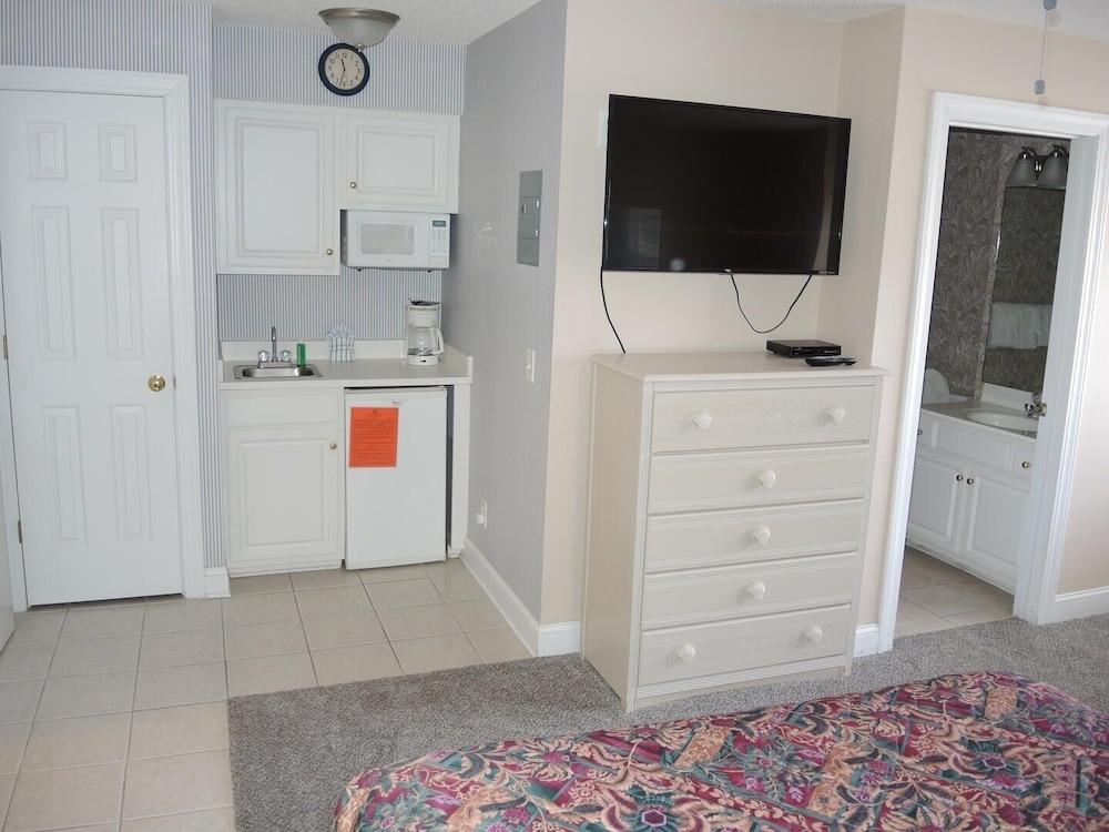 Pool View Unit 1509 at Brunswick Plantation feature 27 hole Golf Course Onsite by RedAwning